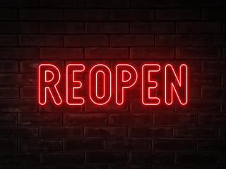 Fototapeta na wymiar Reopen - red neon light word on brick wall background 