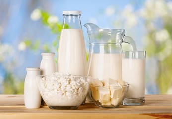 Glass of milk  and Dairy products on wooden desk