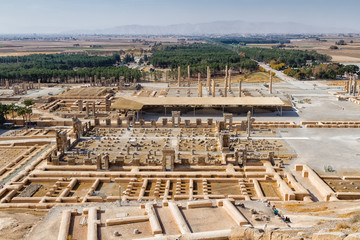 Ruins of Apadana and Tachara Palace behind stairway with bas relief carvings in Persepolis UNESCO...