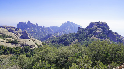 Fototapeta na wymiar Monserat Mountains in Catalonia. Spain. The rocky mountains of Moncerat rise above the Catalan lands.