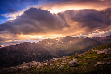 Colorful mountain sunset in the beautiful Aosta Valley in summer, from Gran Paradiso, Italian Alps