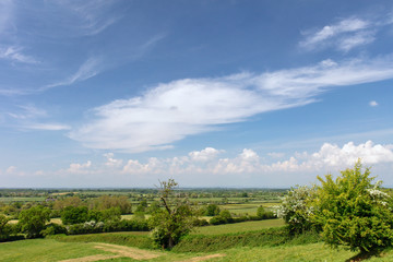 Fototapeta na wymiar Gloucestershire green valley view with blue sky