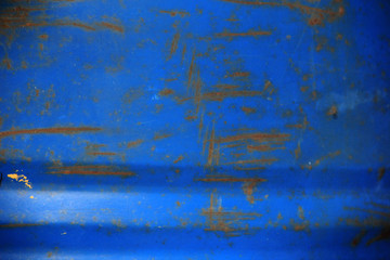 blurred blue barrel background with rusty scratches in grunge style