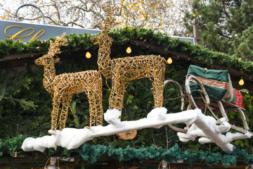 Christmas decoration with Santa's sleigh and reindeer. Stall in Vienna during Christmas market