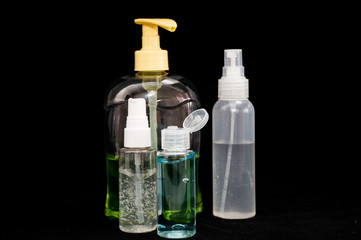 white plastic cosmetic bottle on black background