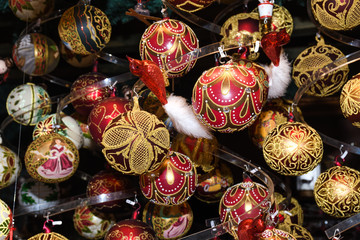 Fototapeta premium Christmas decorations on the market in Vienna.Golden balls, bulbs, bubbles,decorations and ornaments