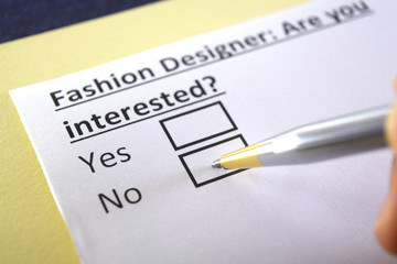 Obraz premium One person is answering question about fashion designer.