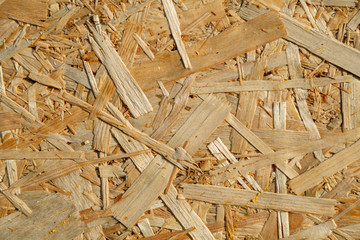 Natural yellow background from particle board close up
