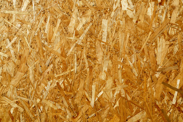 Natural yellow background from particle board close up