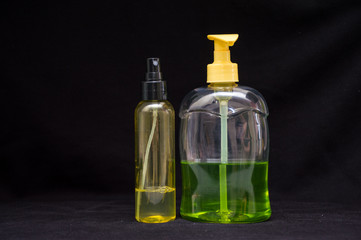 white plastic cosmetic bottle on black background