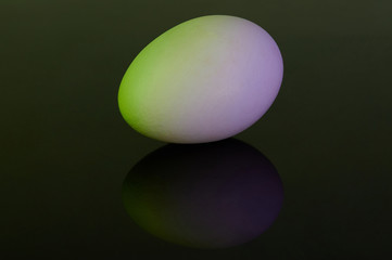 Colorful egg lay on black background