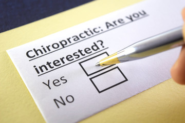 Obraz premium One person is answering question about chiropractic.