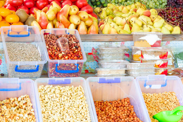 beautiful fruit with nuts on a store counter on a clear
