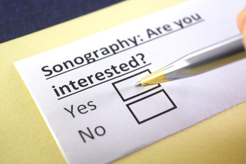 Obraz premium One person is answering question about sonography.