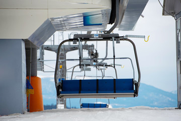 Empty ski-lift in the mountains. End of ski season