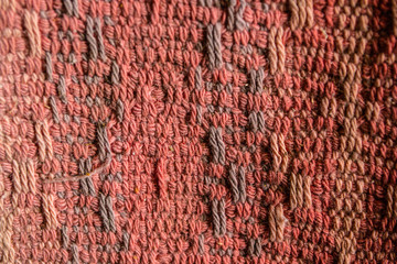 old knitted clothes made of red wool