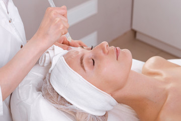 Obraz na płótnie Canvas Facial treatment. Beauty face care, gas-liquid procedure for woman over 30. Skin care concept.