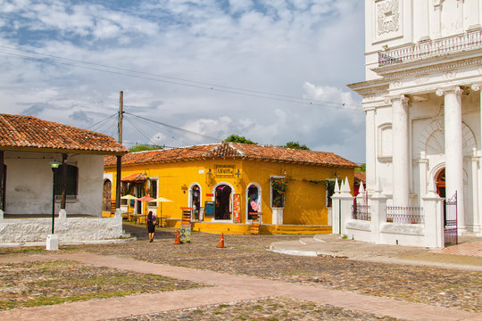 SUCHITOTO, EL SALVADOR - MAY 03: Colorful bright yellow building in Suchitoto, El Salvador on May 03, 2014. Suchitoto is located close to the popular tourist destination - Suchitlan lake.