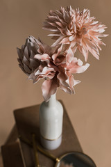 Artificial flowers in a vase close-up. Studio photography of flowers in close-up. Decorative...