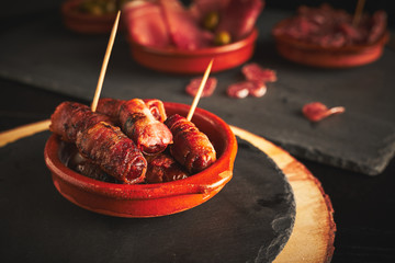 Bacon wrapped dates in a tapas bowl. Spanish Tapas, Spanish Food.