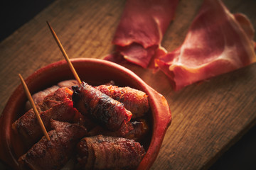 Bacon wrapped dates in a tapas bowl. Spanish Tapas, Spanish Food.