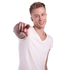 Smiling shirtless male model flirting against white background