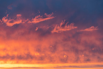 Orange sunset with pink-blue clouds