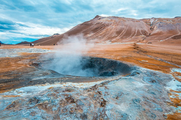 Beautiful landscape in the park of Myvatn with pools of water and boiling sulfur. Iceland