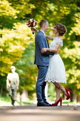 Fototapeta premium Wedding. Young couple, recently married, holding hands