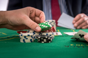 Fototapeta na wymiar Gambling concept man play poker at casino