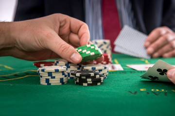Naklejka premium Gambling concept man play poker at casino
