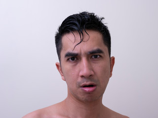 Obraz premium Young handsome man taking a bath