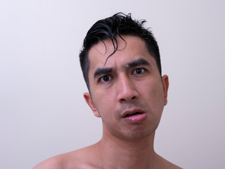 Fototapeta premium Young handsome man taking a bath