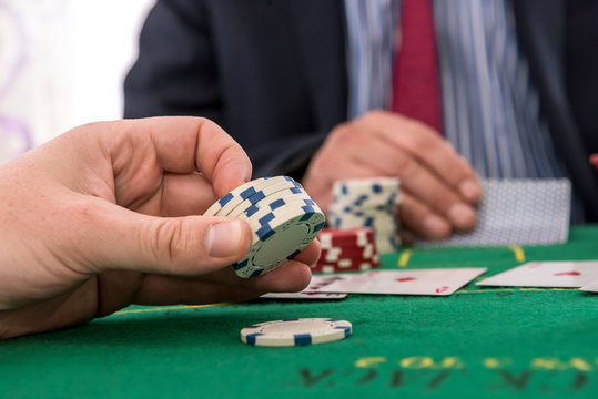 Two players playing poker or blackjack in casino