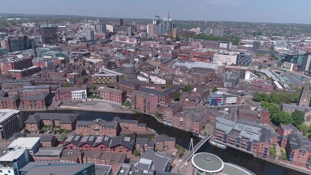 Aerial drone over Leeds City centre river aire construction skyline, West Yorkshire