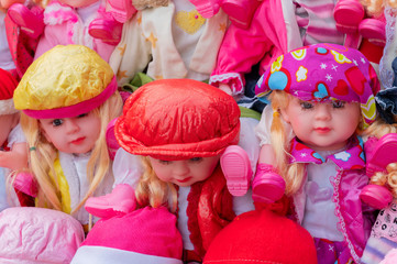 Beautiful cute girl baby dolls for sale at retail shop at Christmas market, New Market area, Kolkata, West Bengal, India.