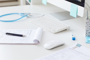 Close-up of medical card on the table with other medical supplies at the hospital