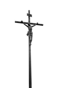 Bottom view of ancient iron statue of the crucifixion of Jesus Christ against white background.