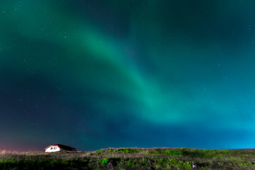 Green lights of the beautiful Northern Lights on the Reykjanes peninsula in southern Iceland