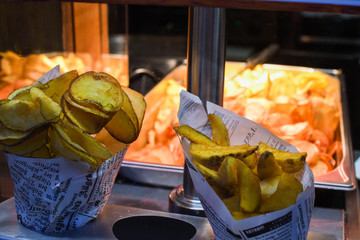Fried swirl potato spiral during street food festival. Fast food
