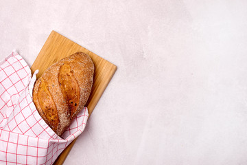 Tasty Homemade Bread on Wooden Board Light Gray Background Top View Copy Space