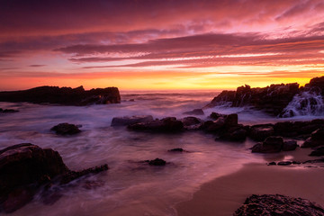 Fototapeta na wymiar Magnifient red sunrise over the coast of Merimbula