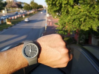 Men watching watches that are worn in the hands, to check the time. the man who looks at the clock so as not to be late for work.