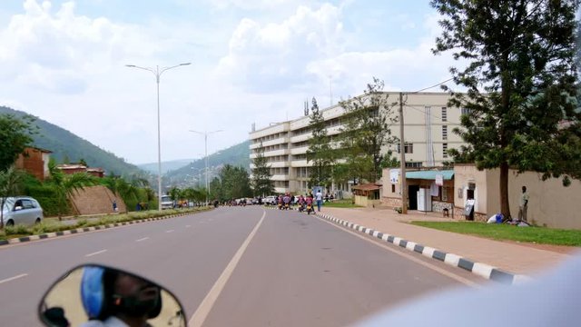 Driving on the back of a motorcycle taxi Kigali Rwanda - 2019