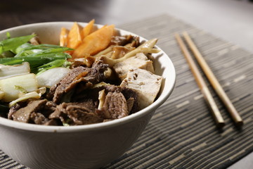 Bowl with vegetables, mushrooms and beef