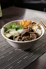 Bowl with vegetables, mushrooms and beef