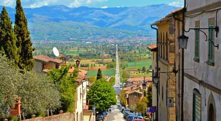 ANGHIARI, ITALY. long straight ancient roman road in Tiber valley that connects Anghiari and San Sepolcro with mountains in background. Arezzo Tuscany, Italy