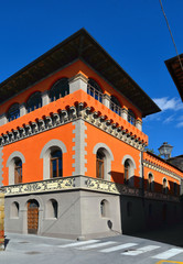 Detail of facade with window and decorations in the medieval village of Sansepolcro near city of Arezzo with house former temple of Freemasonry in Tuscany, Italy