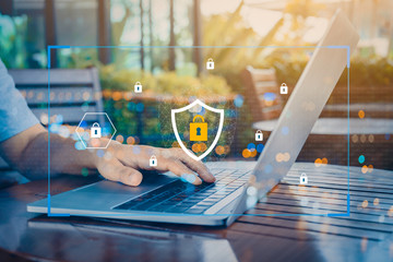 Person using a laptop computer with technology cybersecurity and privacy concept. protection and safe data for global network security.