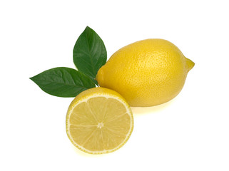 One whole yellow lemon and a half of lemon with green leaves isolated on white background